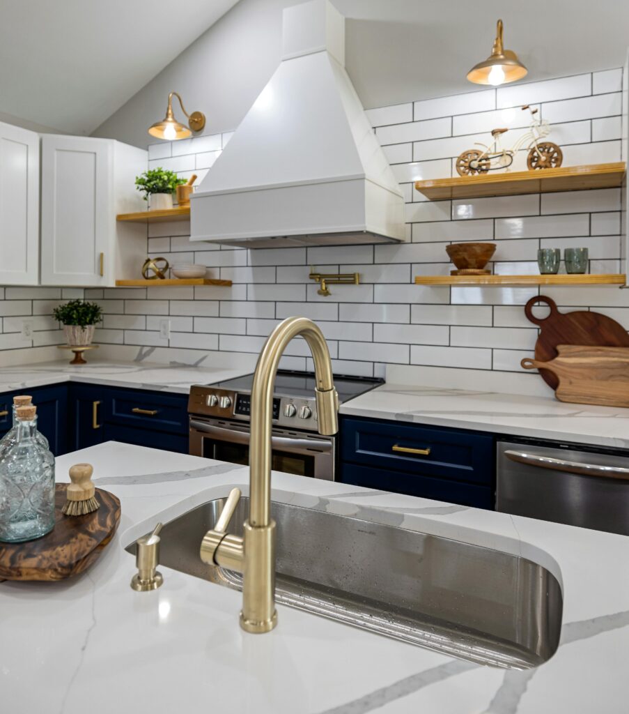 Kitchen sink with brass faucet.